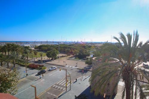 an aerial view of a street with a palm tree at Solvi Hotel - Adults Only in Vilanova i la Geltrú