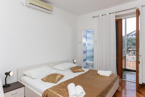 Postel nebo postele na pokoji v ubytování Lapad View Apartments