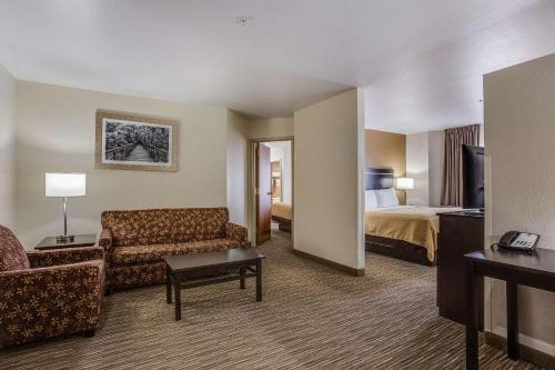 A bed or beds in a room at Quality Inn & Suites