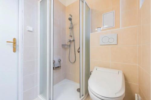 a bathroom with a shower with a toilet and a shower at APTs in OLD TOWN PRAGUE by Michal&Friends in Prague