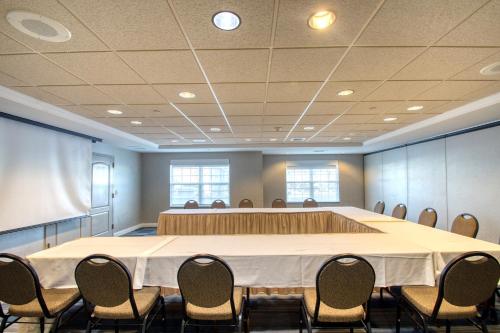 a large conference room with a large table and chairs at Holiday Inn Express Hotel & Suites Milwaukee Airport by IHG in Milwaukee
