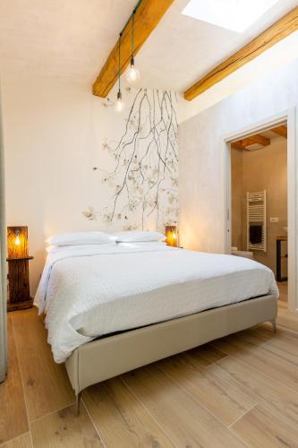 a bedroom with a large bed in a room at Borgo Cantagallo Casa Olivia 2 in Tremosine Sul Garda