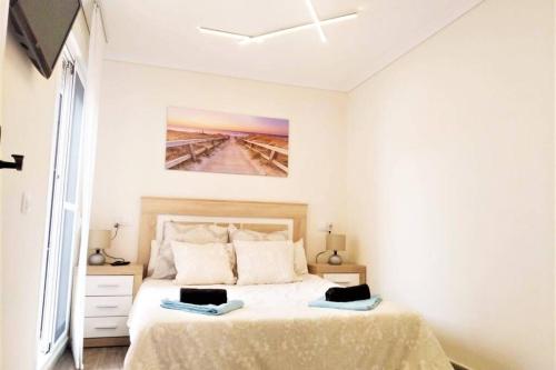Giường trong phòng chung tại La casita soleada - Gran Alacant
