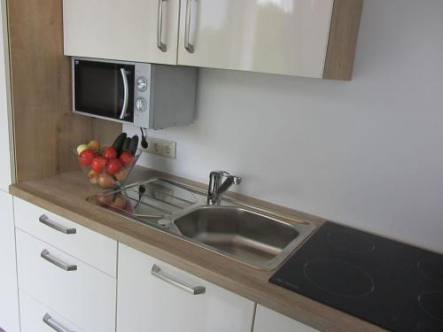 Kuchyň nebo kuchyňský kout v ubytování Apartment Tadić