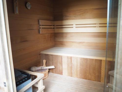 a small wooden cabin with a bunk bed in it at Gîte des Pargo in Férel