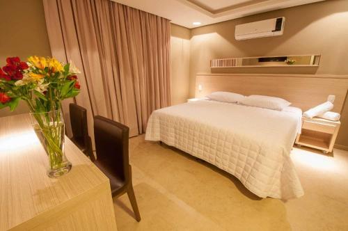 Säng eller sängar i ett rum på Viageiro Casa Hotel