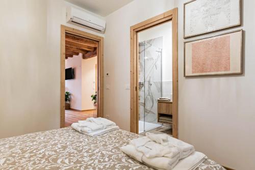 Säng eller sängar i ett rum på Wellness Lodge Riccardo