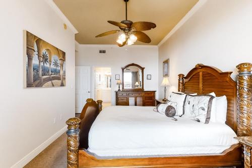 a bedroom with a bed and a ceiling fan at San Remo 406 in Santa Rosa Beach
