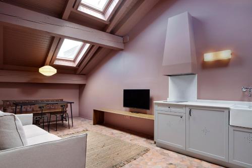 a living room with a kitchen and a dining room at Pamplonapartments Pozo Blanco in Pamplona