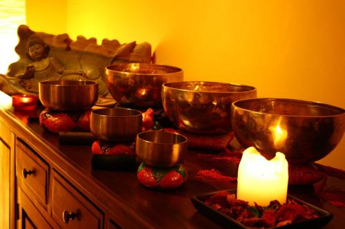a table with bowls and a candle on it at Willa Barbara - ProHarmonia in Lądek-Zdrój