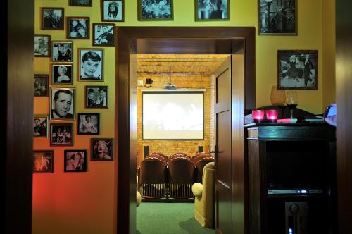 a room with a bunch of pictures on the wall at Willa Barbara - ProHarmonia in Lądek-Zdrój
