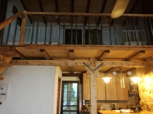 a wooden ceiling with a cross in a room at Villa Haris in Sarti