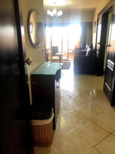 a living room with a table and a couch at sea view apartment in Porto Marina hotel tower in El Alamein