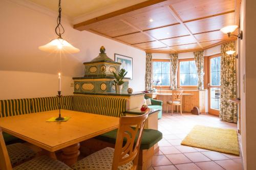 a living room with a wooden table and a dining room at Appartements Fliana St. Anton in Sankt Anton am Arlberg