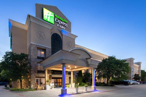 a hotel with a sign on the front of it at Holiday Inn Express Arlington Interstate 20 Parks Mall by IHG in Arlington
