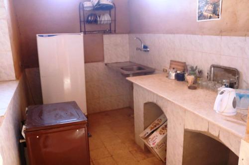 مطبخ أو مطبخ صغير في Desert Rose Guesthouse