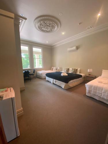 a bedroom with two beds in a room at Teschemakers Resort in Oamaru