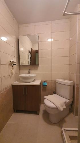 Een badkamer bij Carina Apart Hotel