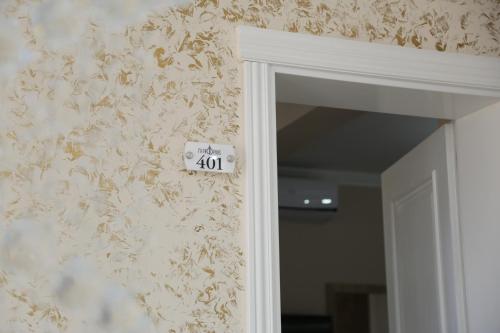 a door with a sign that reads only on a wall at METROPOLIS in Ulcinj