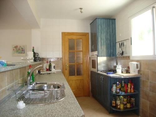 a kitchen with a sink and a counter top at Sierra Verde Polop in Polop