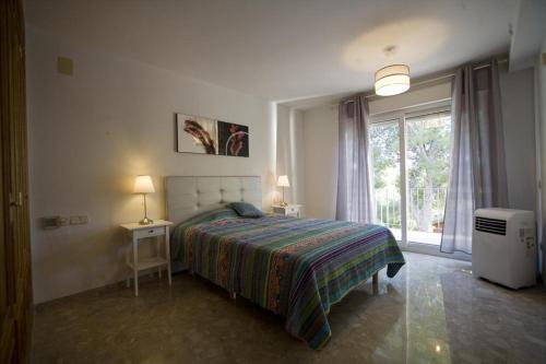 Ένα ή περισσότερα κρεβάτια σε δωμάτιο στο La Guatla