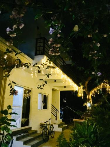 a house with christmas lights on the side of it at Location One Eighty in Bangcusay
