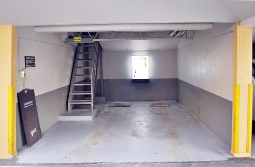 an empty room with a ladder and a window at Ena Hotel Venus in Ena
