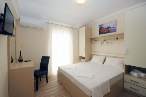 Postel nebo postele na pokoji v ubytování Apartments Royal