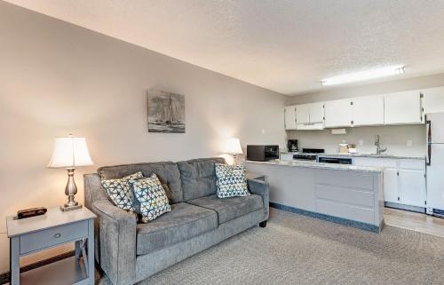 a living room with a couch and a kitchen at Bend Riverside Condos Near Downtown Bend in Bend