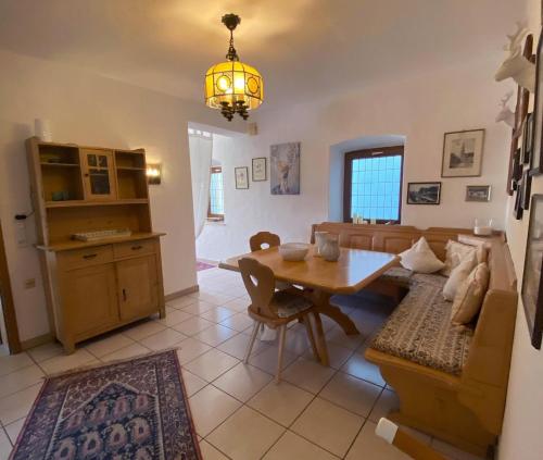 a living room with a table and a couch at Landhaus in Pförring in Pförring