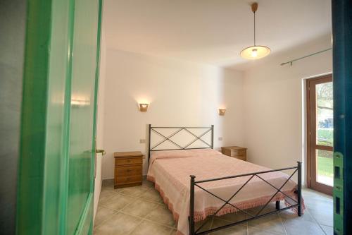 Postel nebo postele na pokoji v ubytování Residence Oasi e Oasi Blu