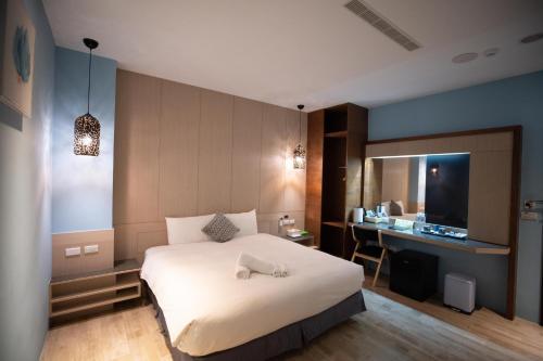 Una cama o camas en una habitación de HUA B&B