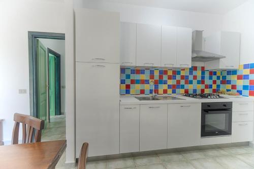 Kuchyň nebo kuchyňský kout v ubytování Residence Oasi e Oasi Blu