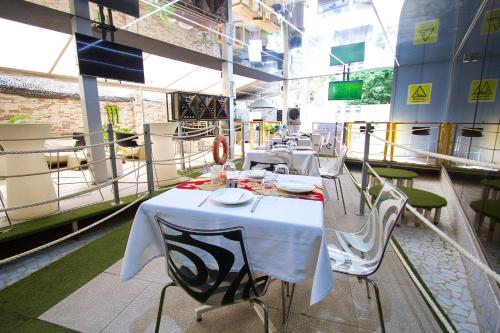 a row of tables and chairs in a restaurant at SV Chrome in Abuja