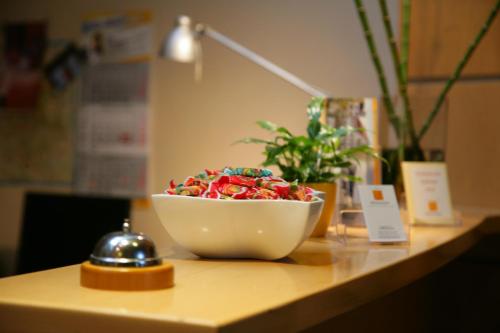 a bowl of sprinkles sitting on a table at Hotel Wilhelmshöhe in Neuenrade