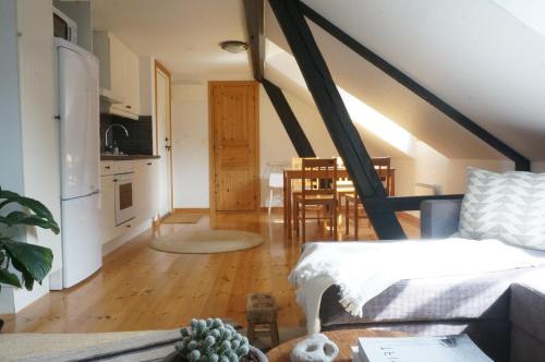 a room with a kitchen and a living room at Kåseberga Hideout in Kåseberga