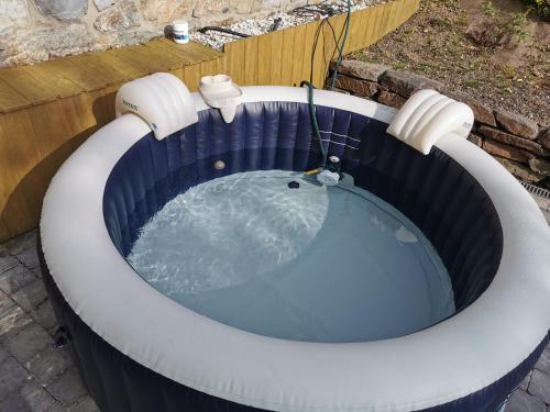 a jacuzzi tub in a backyard at VILLA GABRIEL in Trois-Ponts