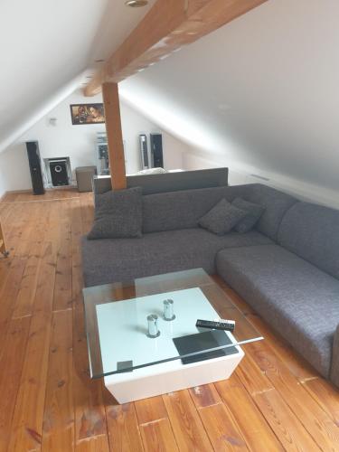 a living room with a couch and a table at VILLA GABRIEL in Trois-Ponts
