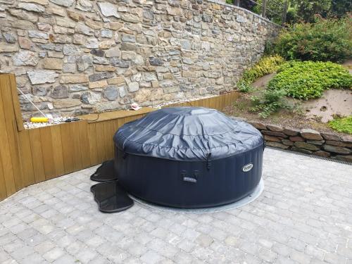 a large blue barrel sitting on a patio at VILLA GABRIEL in Trois-Ponts