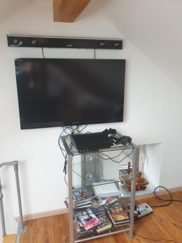 a flat screen tv hanging on a wall at VILLA GABRIEL in Trois-Ponts