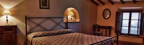 Ένα ή περισσότερα κρεβάτια σε δωμάτιο στο Agriturismo Montalbino
