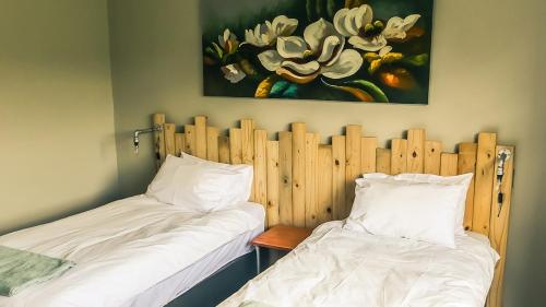 Un ou plusieurs lits dans un hébergement de l'établissement Buffalo House @Bankenkloof Private Game Reserve