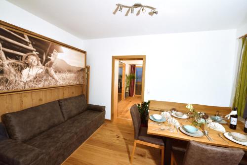 a living room with a couch and a table at Urlaub im Stall in Irdning