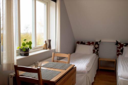 Postel nebo postele na pokoji v ubytování Ljungs Fem Rum