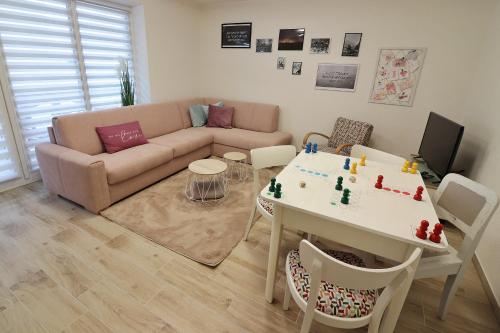 a living room with a couch and a table at Chata Matzo in Mýto pod Ďumbierom