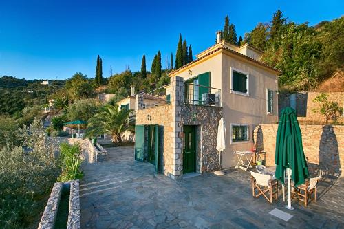 a house on a hill with a patio at Kissakas Villas in Leonidion