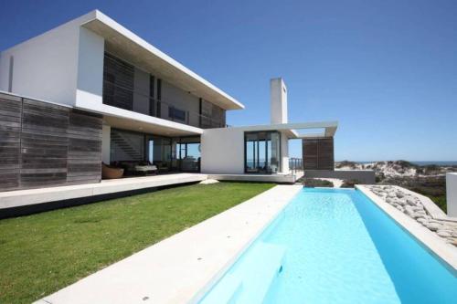 an image of a house with a swimming pool at VAME Beachfront in Yzerfontein