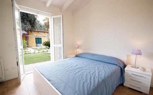 מיטה או מיטות בחדר ב-Residence Baia La Ruota