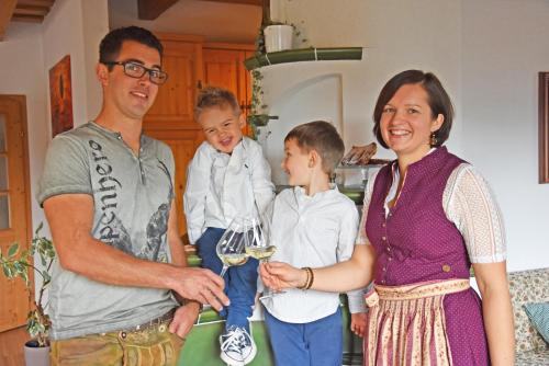 a man and a woman holding a glass of wine at am Jaukhof Familie Stiendl in Neudorf im Sausal