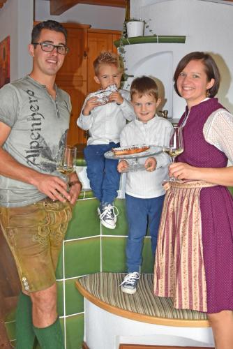 a man and a woman and two children standing on a stairs at am Jaukhof Familie Stiendl in Neudorf im Sausal
